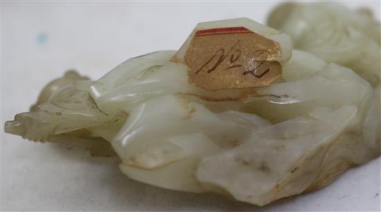 A Chinese pale celadon jade group of the immortals Li Tieguai and He Xiangu, 18th/19th century, 8cm, wood stand